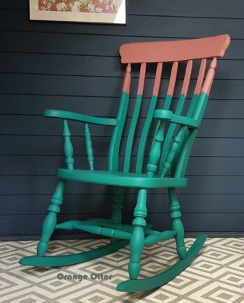 Two-tone teal and pink painted wooden rocking chair