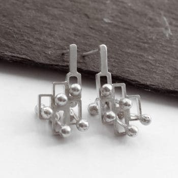 Kinetic small silver stud earrings