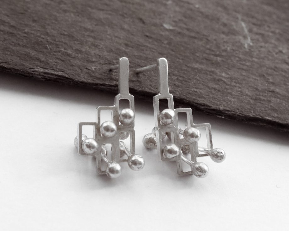 Kinetic small silver stud earrings