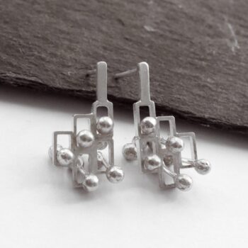 Kinetic small silver stud earrings