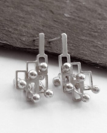 Kinetic small silver stud earrings