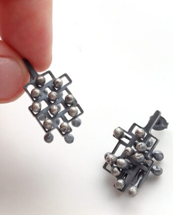 Kinetic large silver stud earrings, style 1.