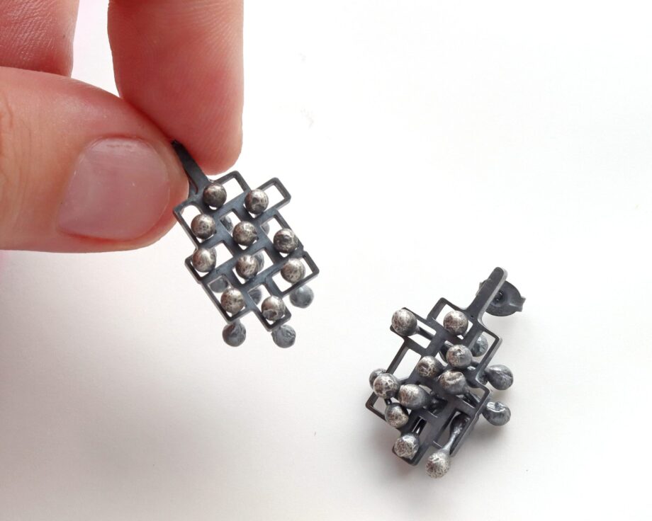Kinetic large silver stud earrings, style 1.