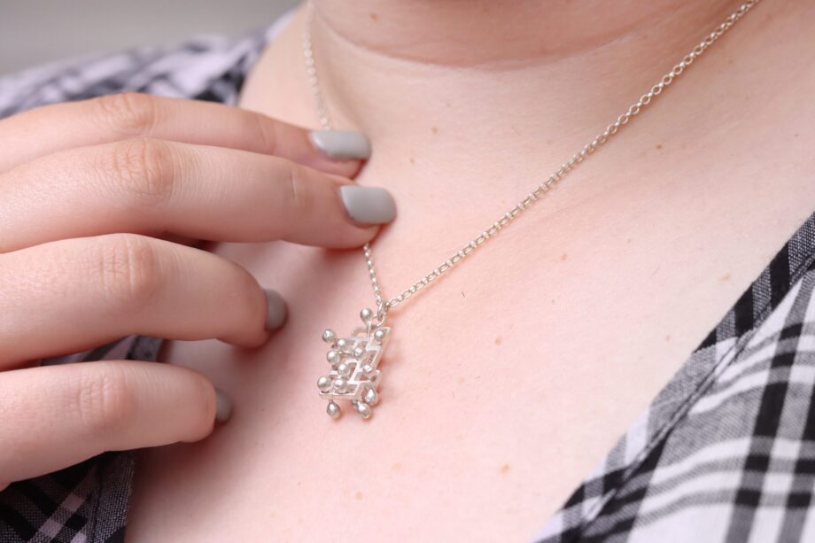 Kinetic small fidget silver pendant, style 1.