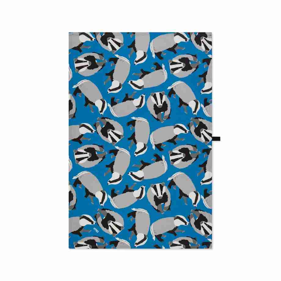 Flat lay image of blue badgers organic cotton tea towel from Ummpixies