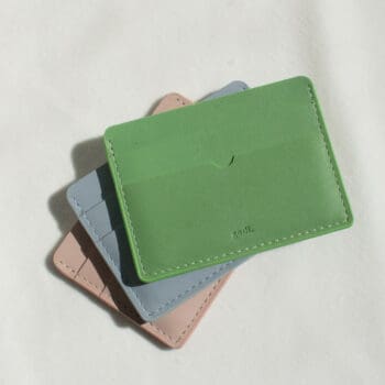 Handmade Leather Cardholder shown with the Sea Green Colour placed on top of the Ice blue and Nude Pink