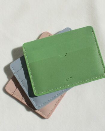 Handmade Leather Cardholder shown with the Sea Green Colour placed on top of the Ice blue and Nude Pink