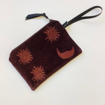 Luxury Chocolate Velvet Zip-Up Pouch with copper hand printed Sun and Moon design, with black grosgrain wrist strap