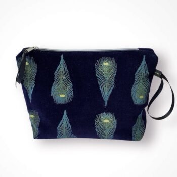 Luxury navy velvet makeup bag with blue peacock feathers print with golden shimmer