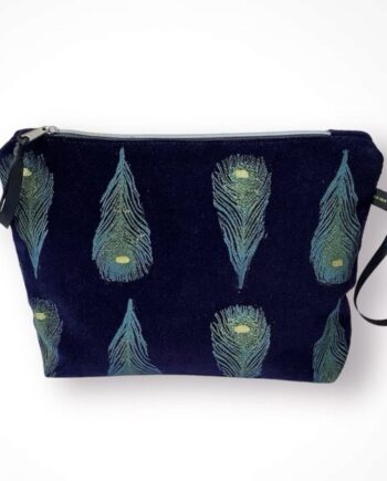 Luxury navy velvet makeup bag with blue peacock feathers print with golden shimmer