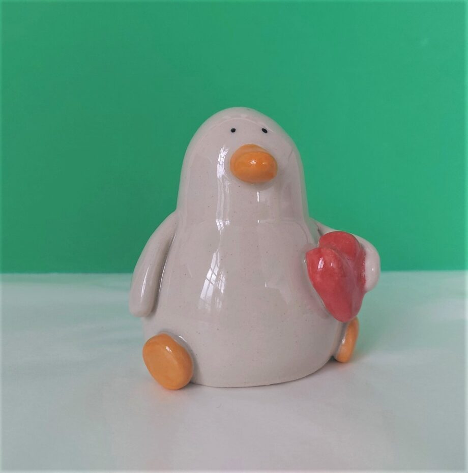 Ceramic duck holding heart