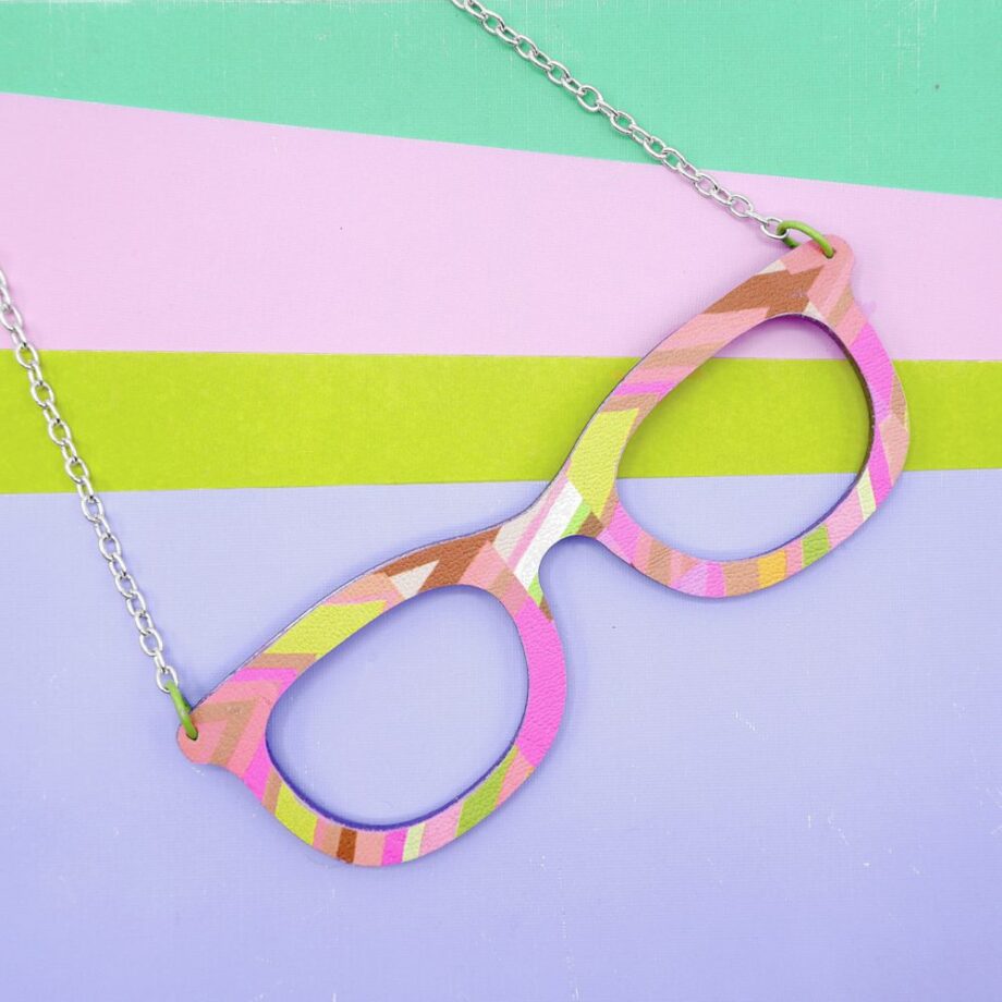 Pink, yellow, and orange retro striped glasses necklace.