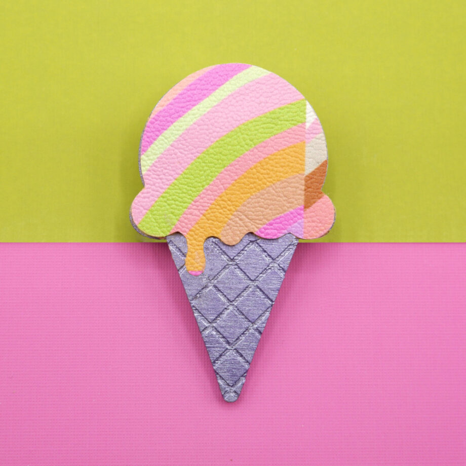 A vibrant sorbet coloured ice cream and cone shaped brooch. With zesty yellow, orange, pink and lime patterned design. A quirky, colourful handmade pin for fun statement style