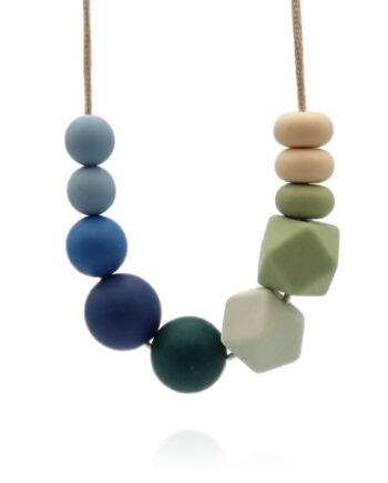 Green, blue and cream-coloured necklace inspired by the Isesjø lake in Norway, on white background