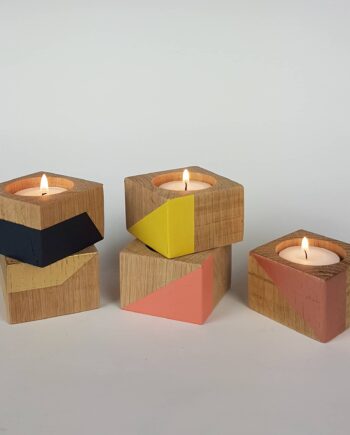 Group of small wooden candle cubes colourful display
