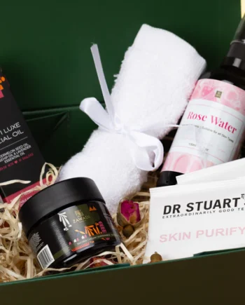 Spoil Her Self Love Gift Box featuring Makeda Glow Pot, Tikiti Luxe facial oil, a bamboo face towel, skin teas and natural skincare treats beautifully arranged in a box