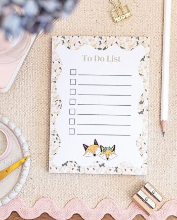 A6 To Do List Notepad, featuring 2 cute foxes dressed for fun, the edges of the notepad feature a crackle colour design