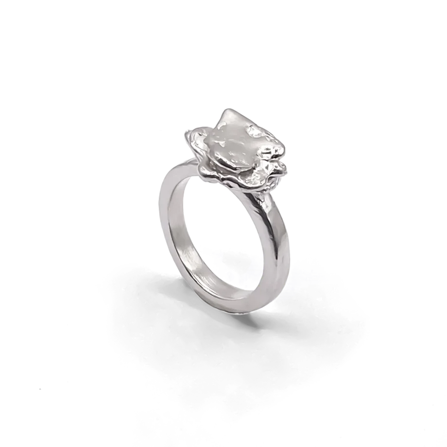 Studio shot of sterling silver flower ring with organic petal texture