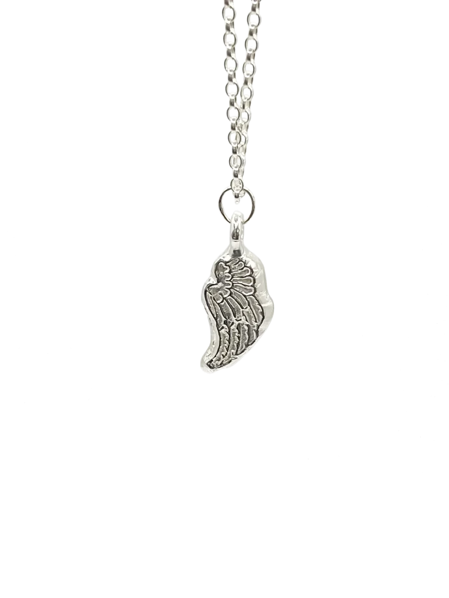 Sterling silver angel wing pendant on chain, white background