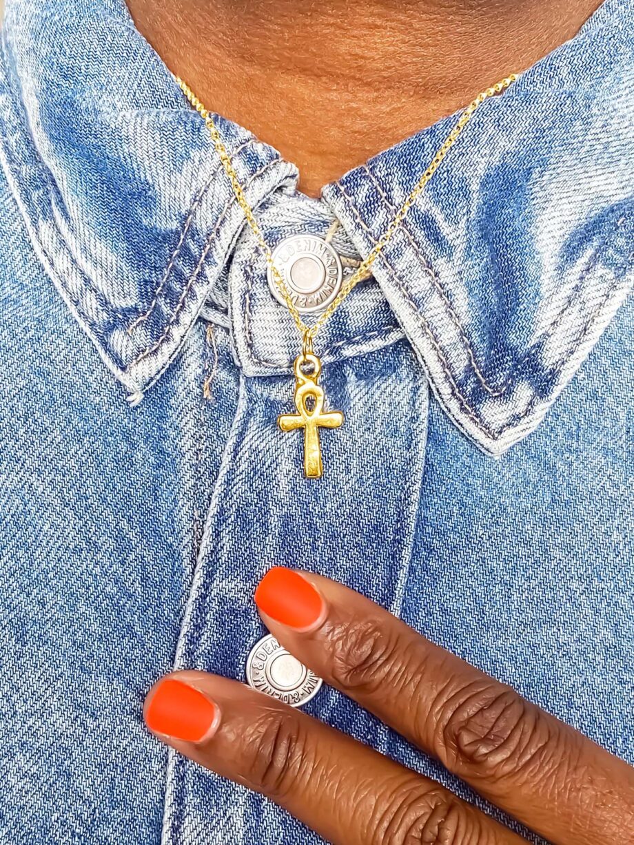 Gold Ankh Pendant worn with denim shirt and orange nail polish