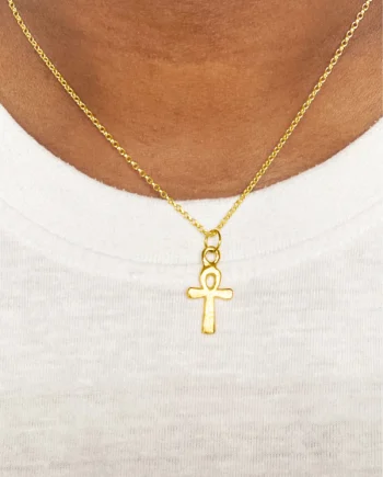 Gold Ankh Pendant worn on model with white top
