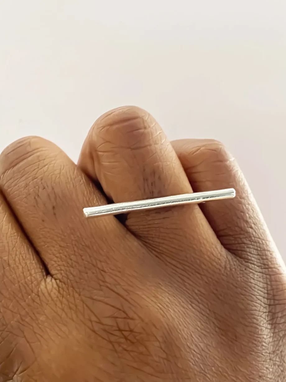 Front view of the Sculpted Bar Ring worn on finger.