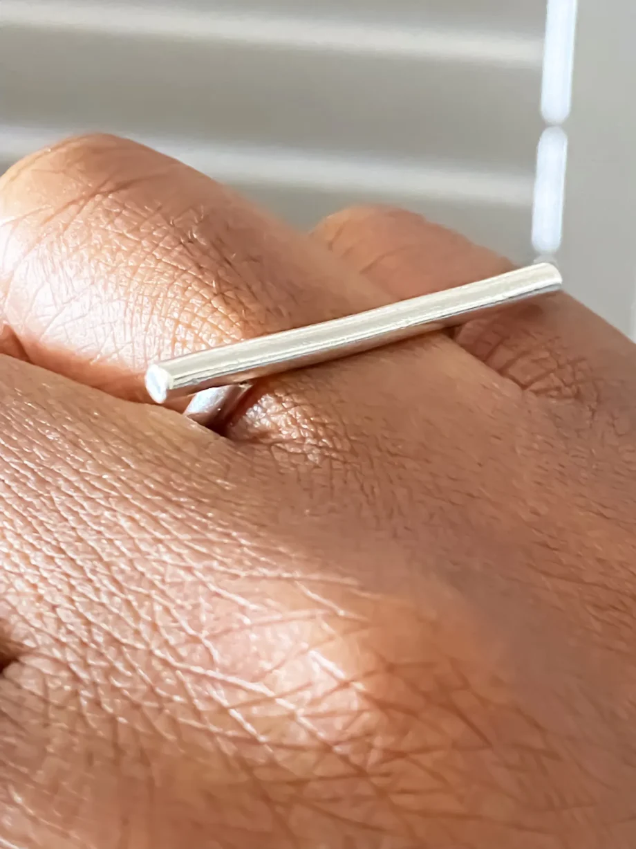 Close-up of the Sculpted Bar Ring on hand, highlighting bar detail.