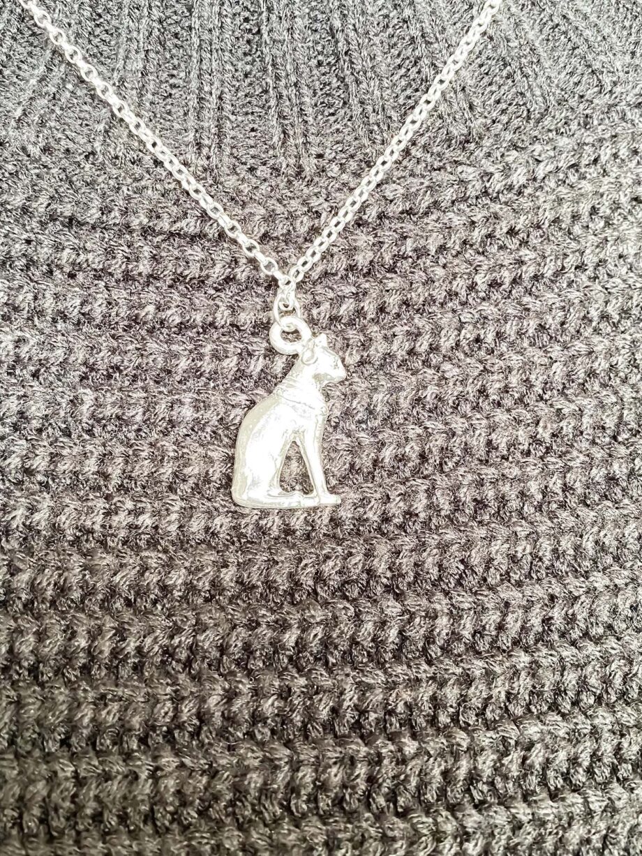 Silver Bast Cat pendant worn on black knitwear
