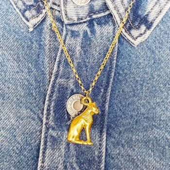 Gold Bast Cat pendant styled with denim