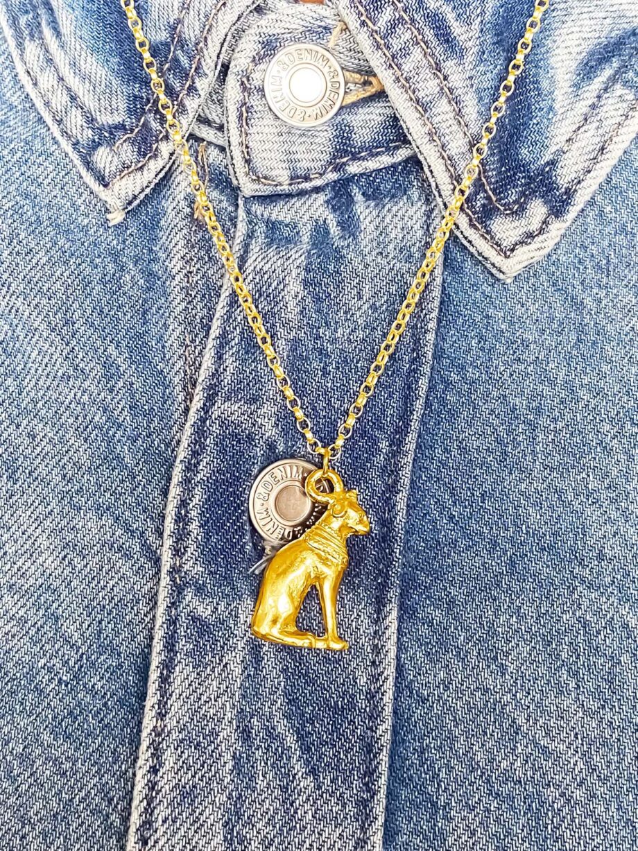 Gold Bast Cat pendant styled with denim