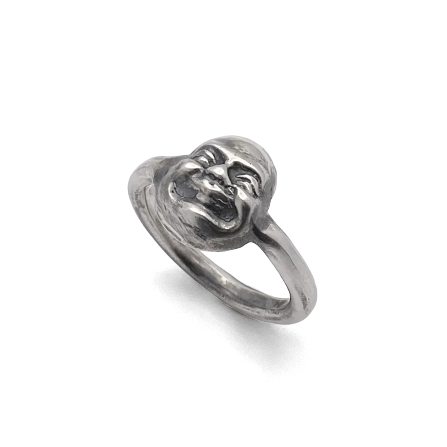 ngled view of Buddha Face Ring showing band and face detail