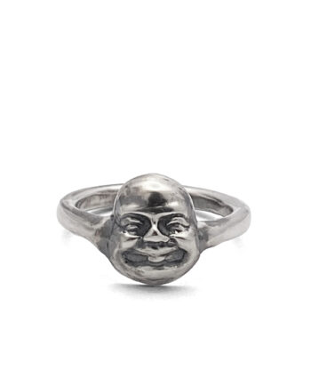 Front view of handcrafted Buddha Face Ring in oxidised silver on white background