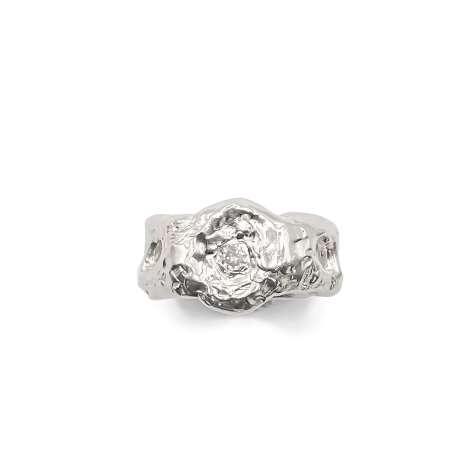 Sterling silver ring with organic cutouts and central gemstone