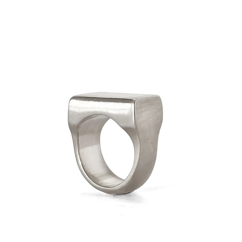 Angled view of modern square-faced silver ring