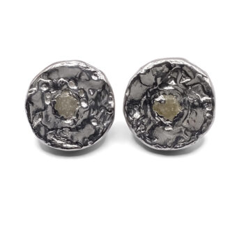 Close-up of Grain Circle Stud Earrings highlighting texture and stone