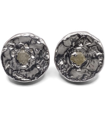 Close-up of Grain Circle Stud Earrings highlighting texture and stone