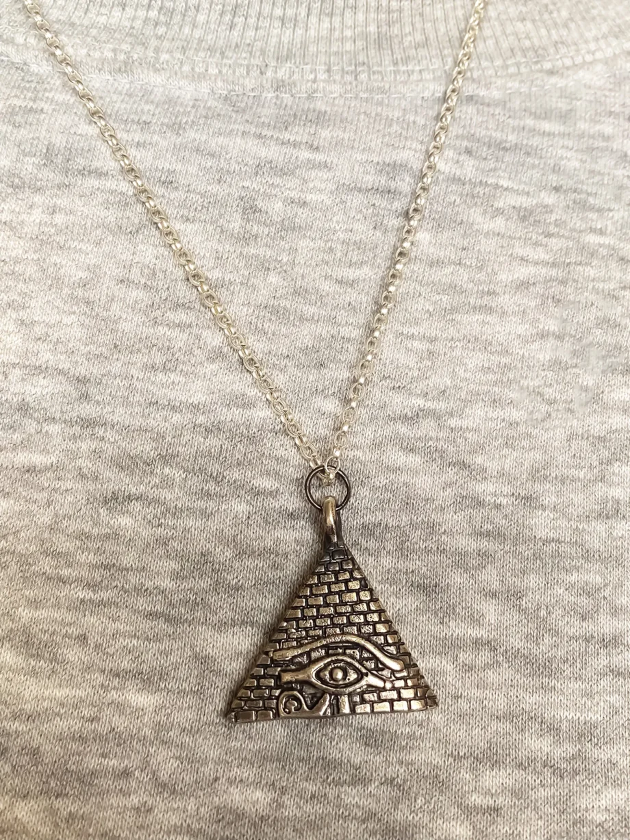Horus Eye Pyramid Pendant worn with casual grey top