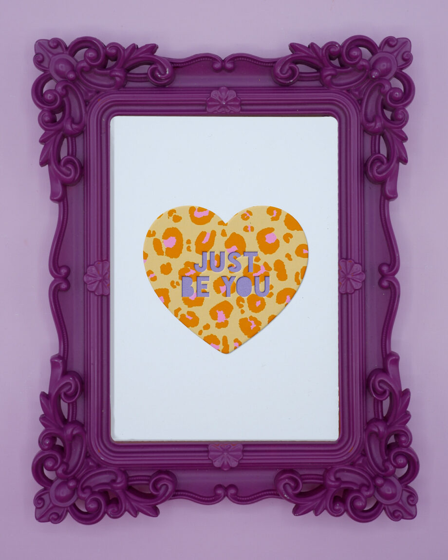 Illustration of a heart filled with brown and pink leopard print. Faux 3D effect cut-out letters read "Just Be You". Printed on Marrutt cotton rag stiff printer paper