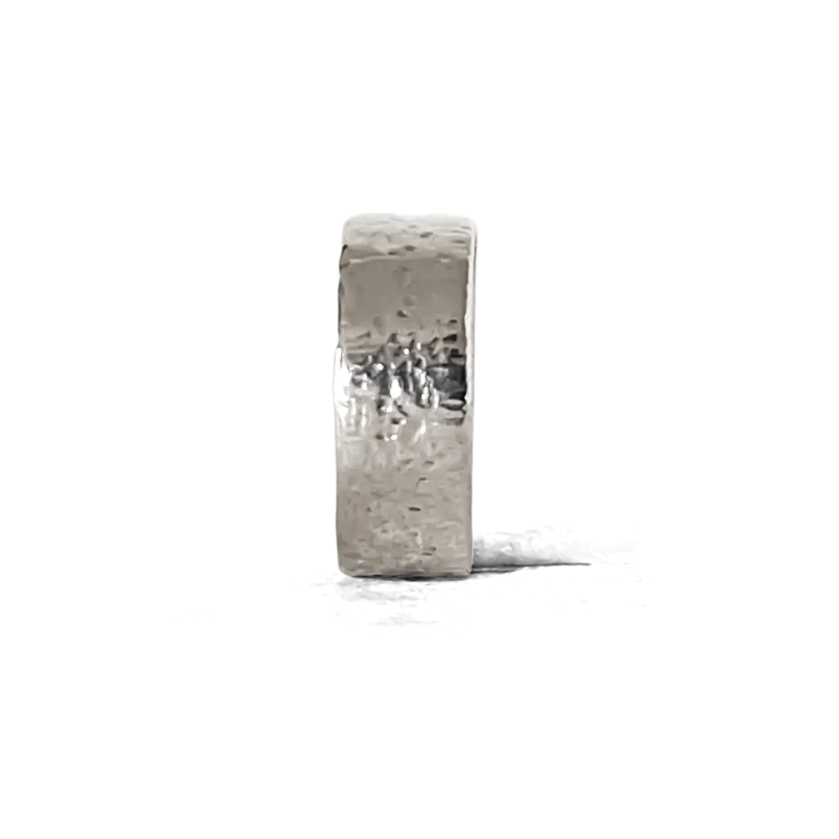 Side profile of a hammered silver ring on a clean white background.