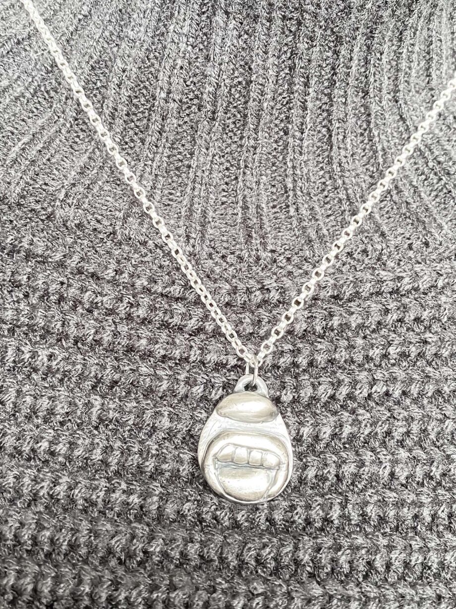 Tongue & Teeth Pendant styled over ribbed grey jumper