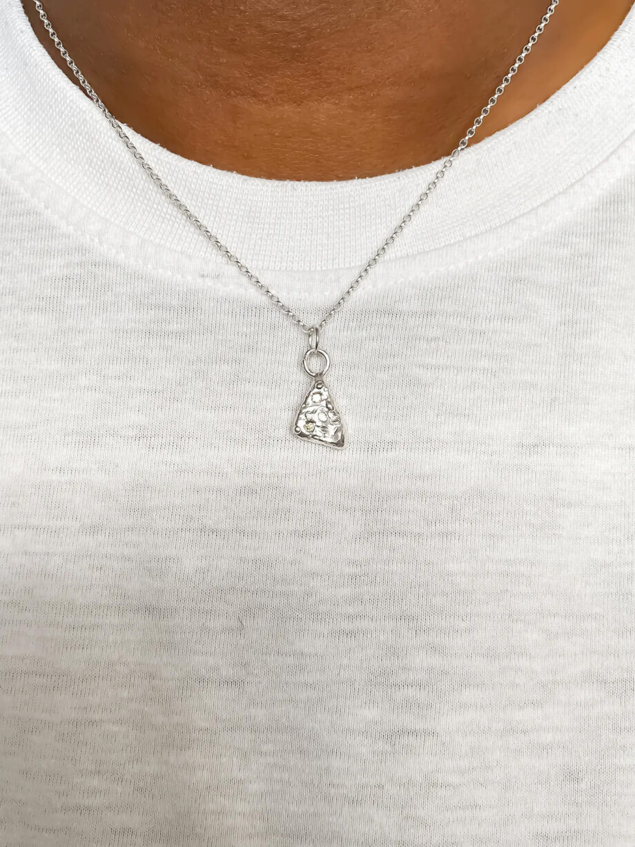 Sterling silver pendant worn with white top.