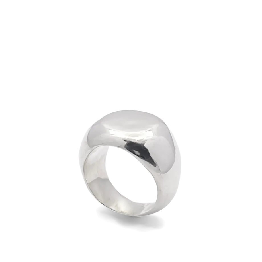 Angled view of a silver round signet ring on a white background.