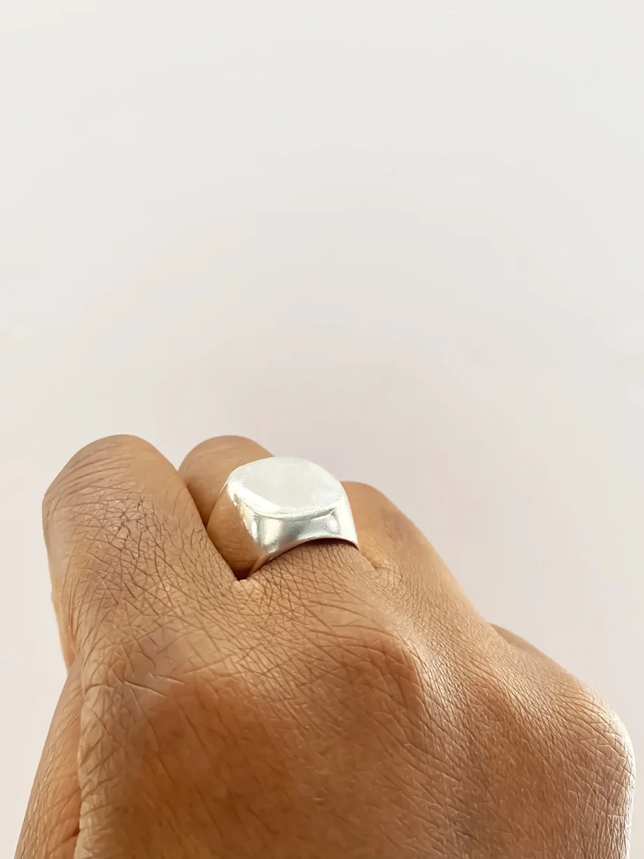 Square-Round Signet Ring worn on hand, angled view