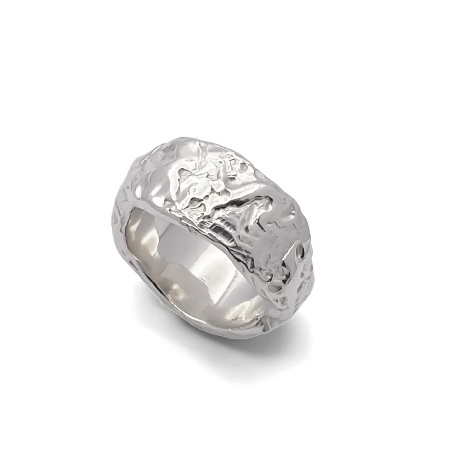 Angled view of textured silver ring with uneven shape