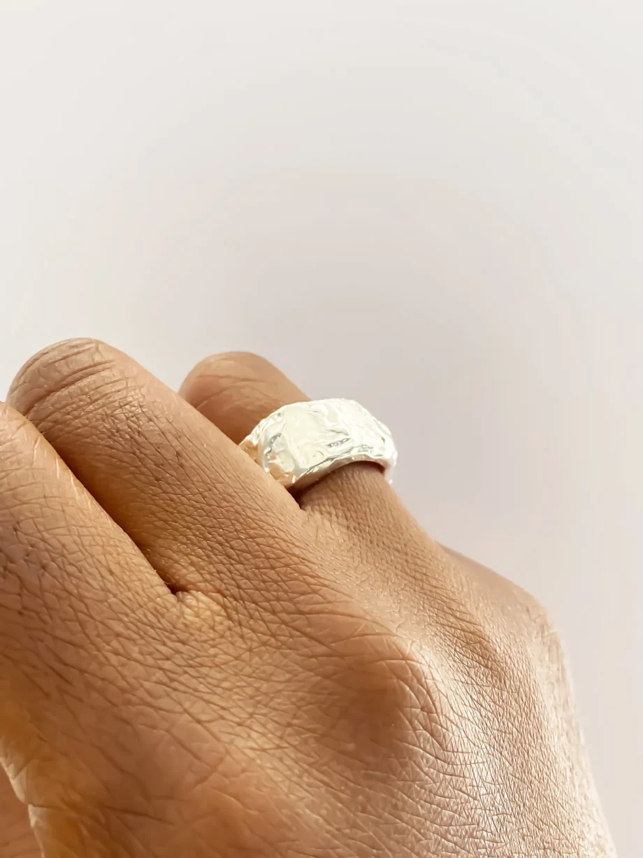 Organic silver band ring on hand, handcrafted in London