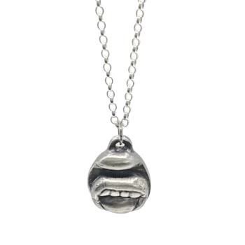 Sterling silver Tongue & Teeth Pendant displayed front-on with Belcher chain