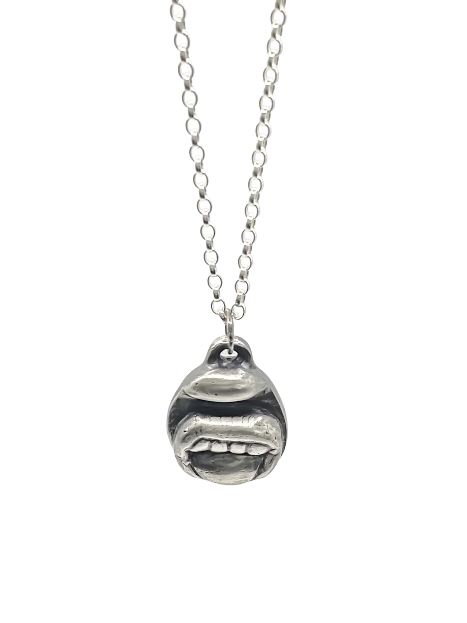 Sterling silver Tongue & Teeth Pendant displayed front-on with Belcher chain