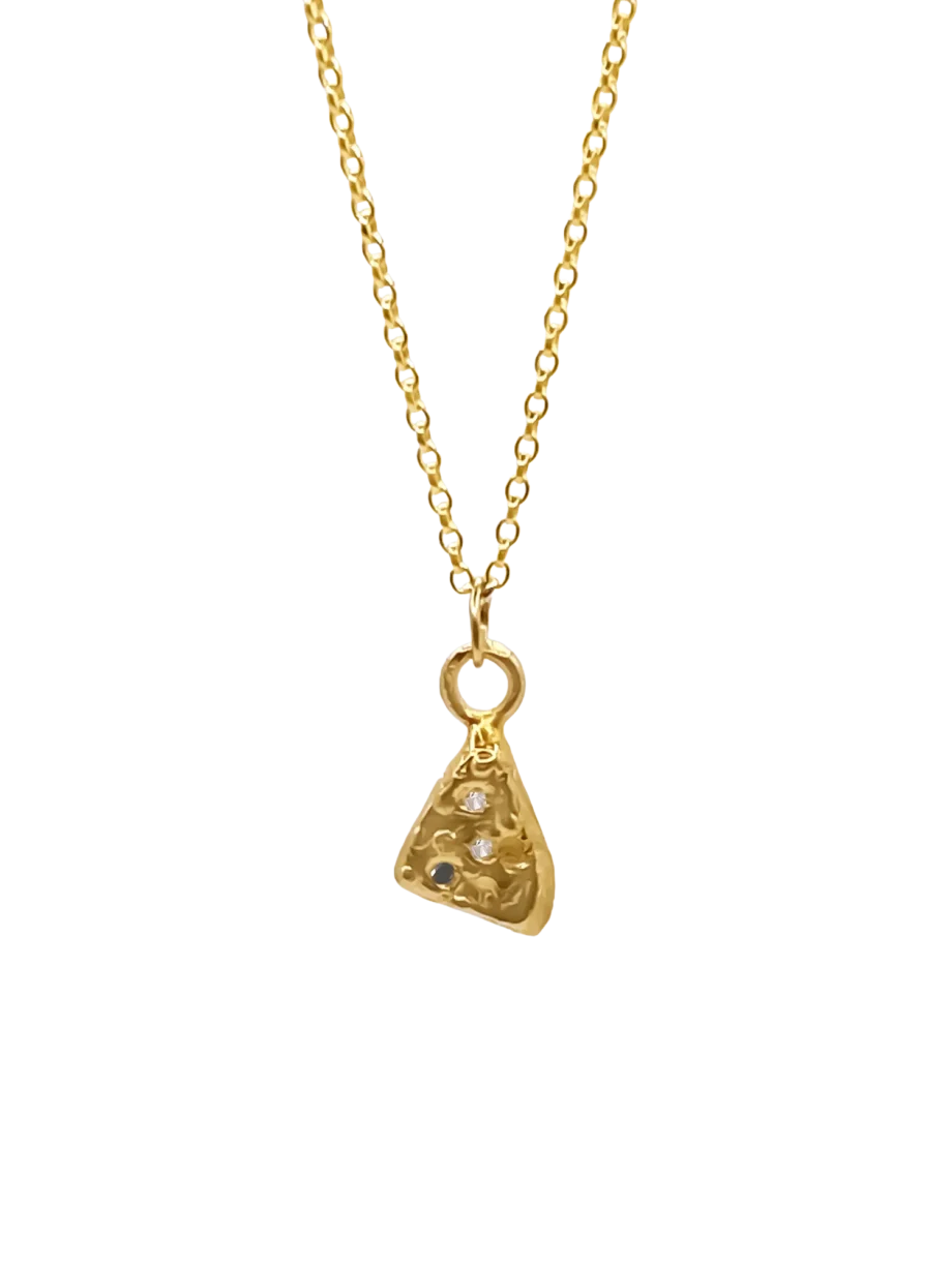 Side view of gold triangular pendant with textured finish and stones.