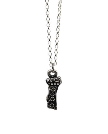 Twig Pendant in recycled silver on chain, displayed on white background