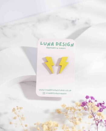 Small lightning bolt-shaped stud earrings made from yellow leather